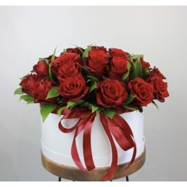 25 red roses in a round box.